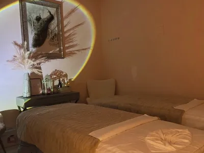 A softly lit private massage room